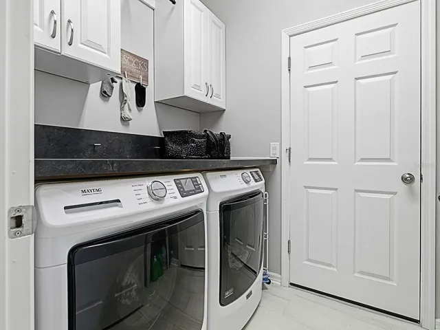 Convenient laundry room with ample space and storage