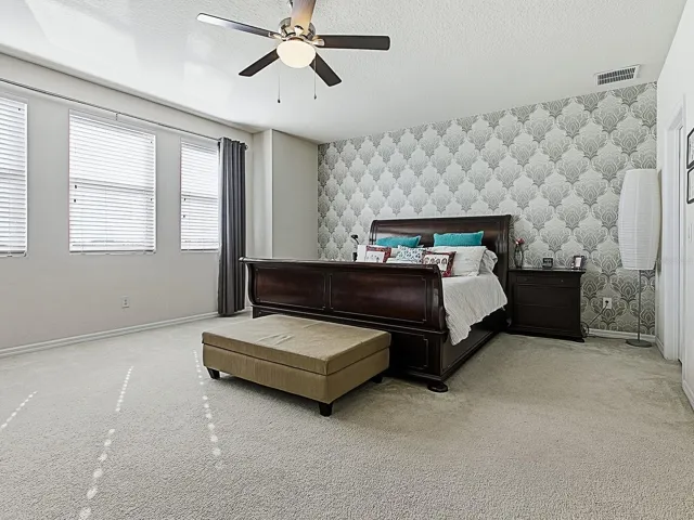 Expansive primary suite with stunning lake views.