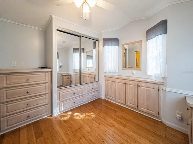 Bedroom with built in closet and dressers