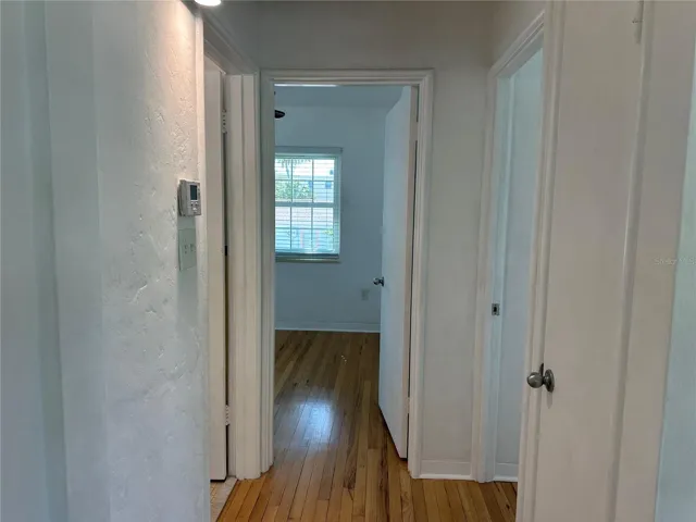 Looking Straight in to hall 2 bedrooms and Bathroom.
