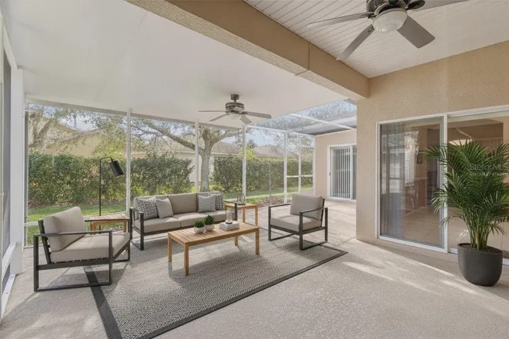 Lanai showing privacy hedge. Virtually staged