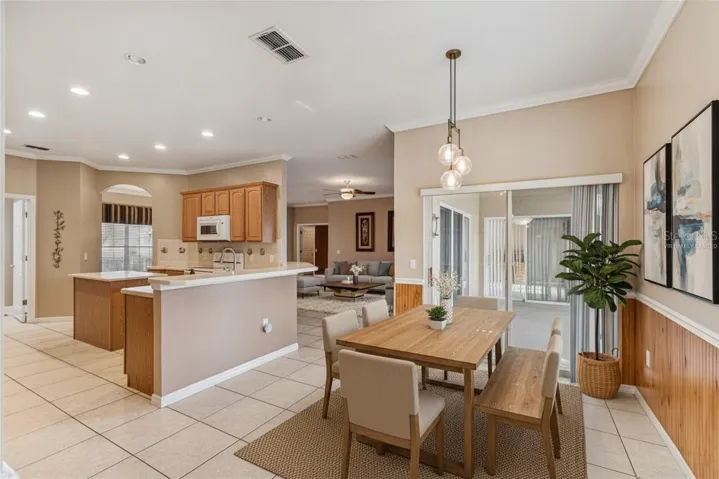 Virtually staged kitchen table looking out on to the lanai