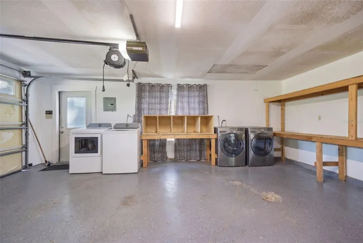 Double Laundry hookup and built in shelves in 3 car garage