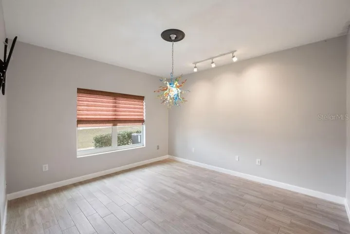 Main Suite with Tile Floors, Track Lighting, Custom Shade and Hand Blown Glass Light Fixture