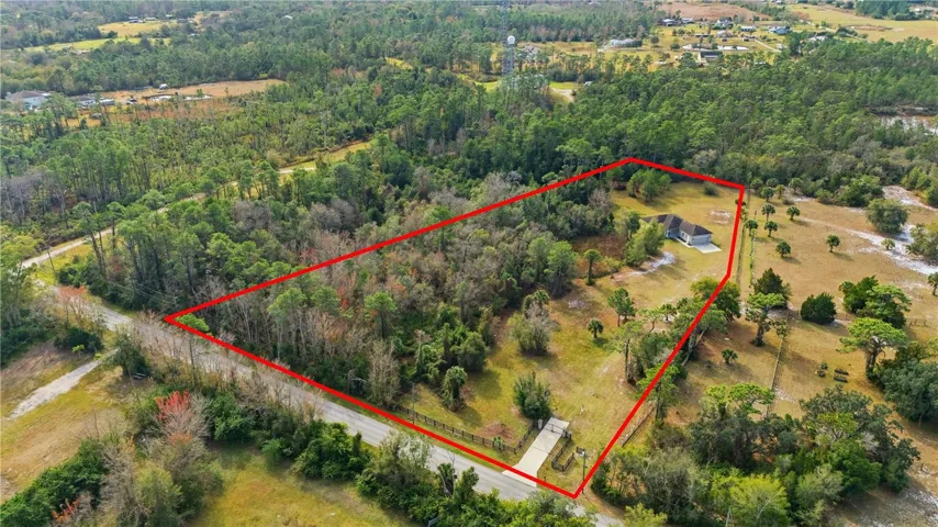 Aerial View of Property. Red lines for illustration purposes only. Buyer to verify property lines with survey.
