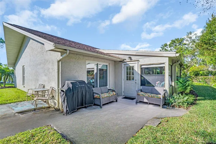 Rear back patio big enough for outdoor furniture & grill~