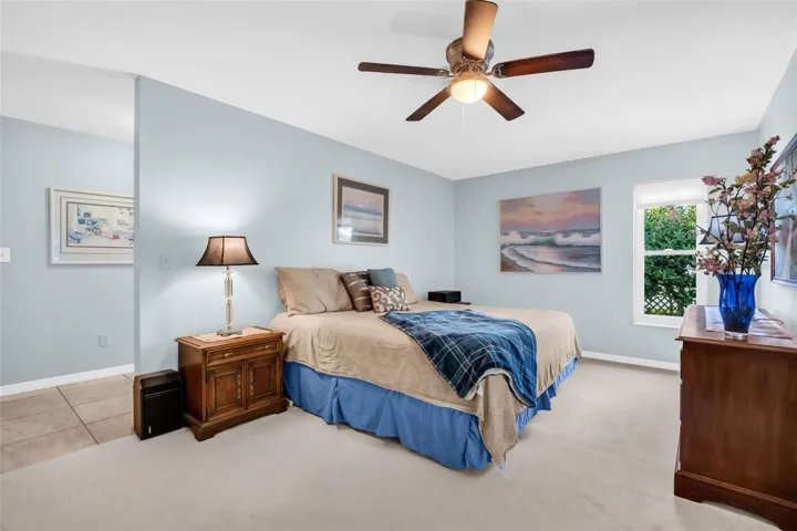 Massive primary retreat offering private green views, a dressing room with a walk-in closet to the updated en-suite bath~