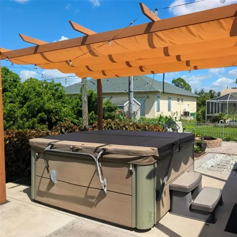 Jacuzzi with canvas covered pergola