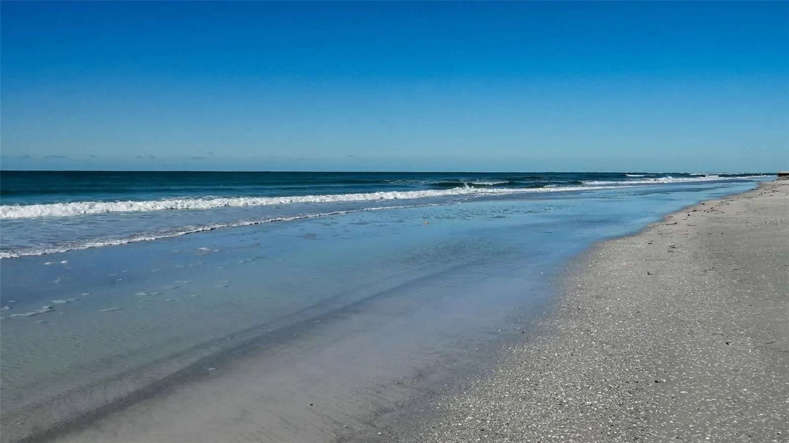 Enjoy nearly 100 feet of private beach on Longboat Key's widest section!