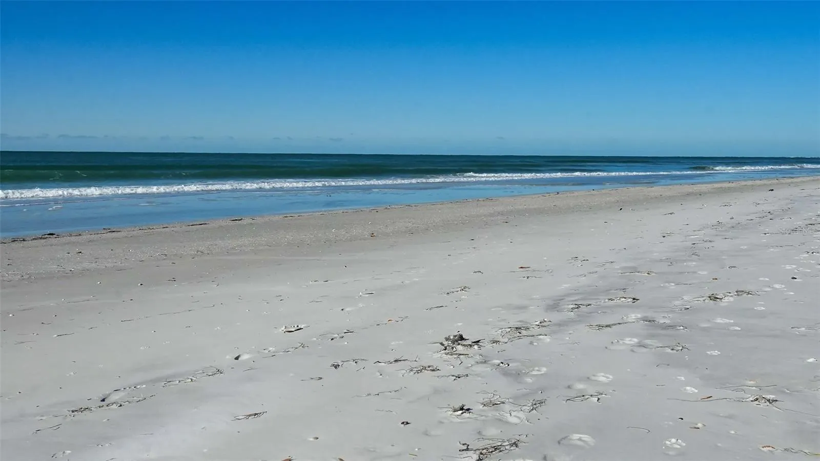 Enjoy nearly 100 feet of private beach on Longboat Key's widest section of newly enhanced beach