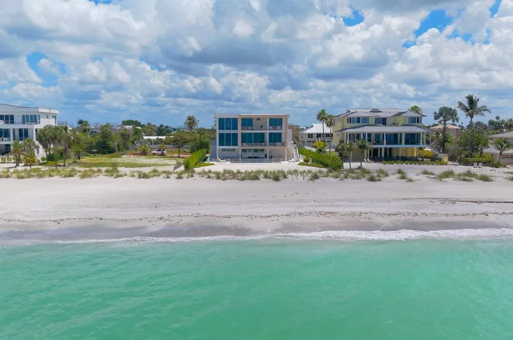 Welcome to 6489 Gulfside road on Longboat Key. Recently completed and ready for move in! Designed by DSDG Architects, built by Seaward Homes