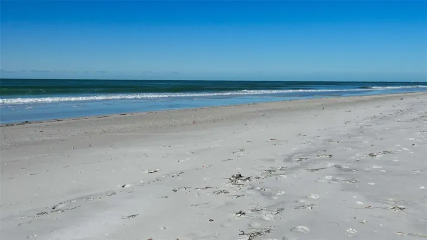Enjoy nearly 100 feet of private beach on Longboat Key's widest section of newly enhanced beach