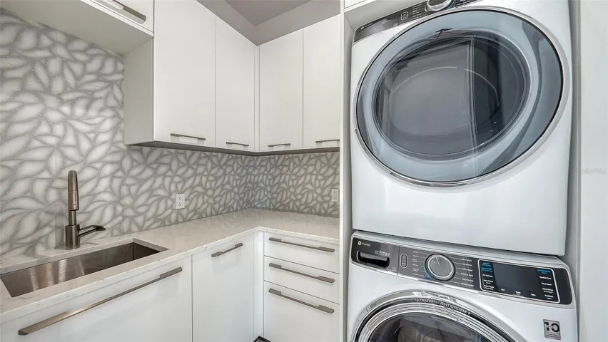 Second floor laundry room has full size washer &amp; dryer