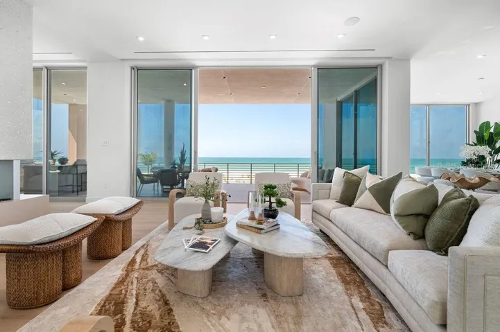 Open living space features a vapor fireplace, opening to the 40 foot terrace