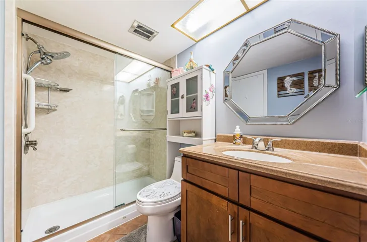 Updated bathroom with vanity, toilet and shower