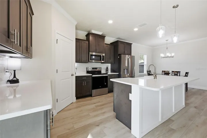 Chef's kitchen-wide plank flooring