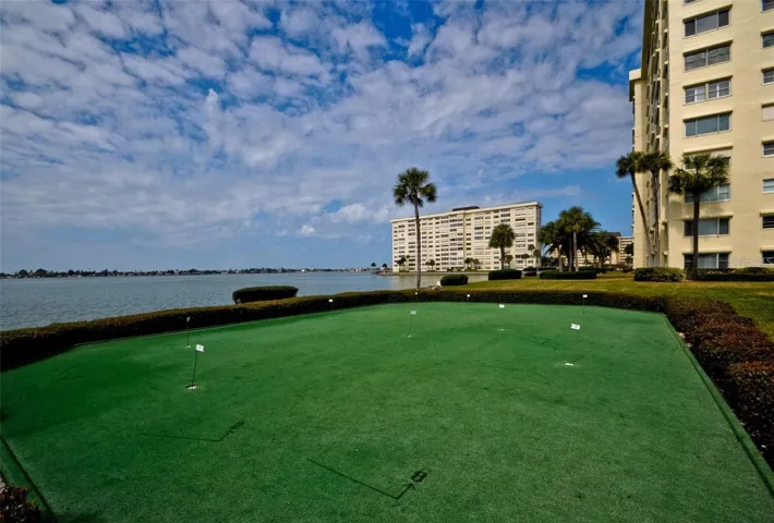 Putting green with waterfront views
