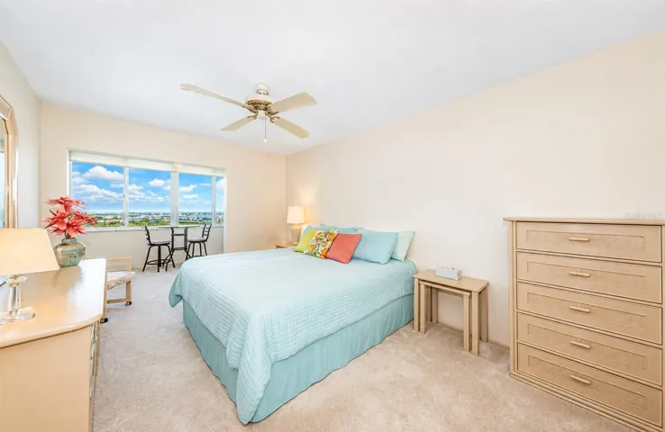 Bedroom with water view from sunroom