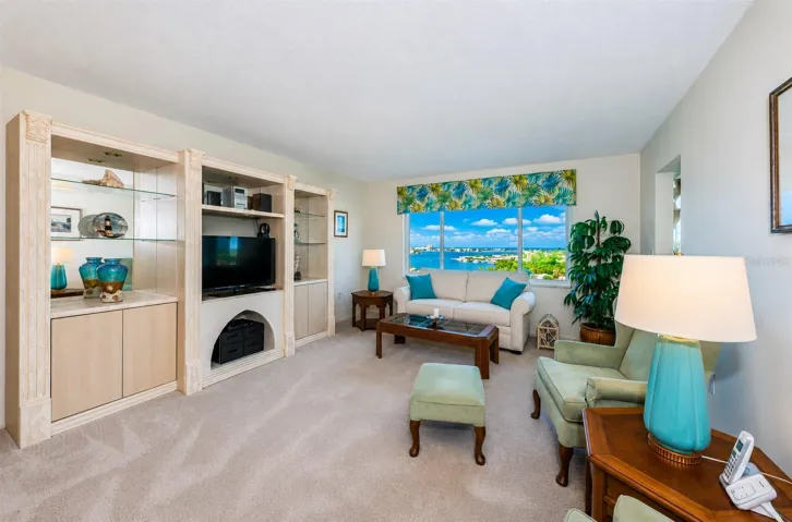 Living room with carpet and HURRICAN window with WARRANTY