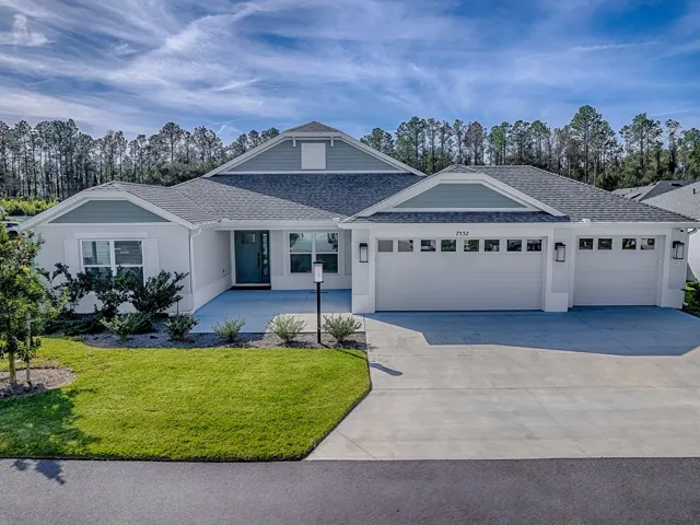 House at drone height looking at beautiful preserve area