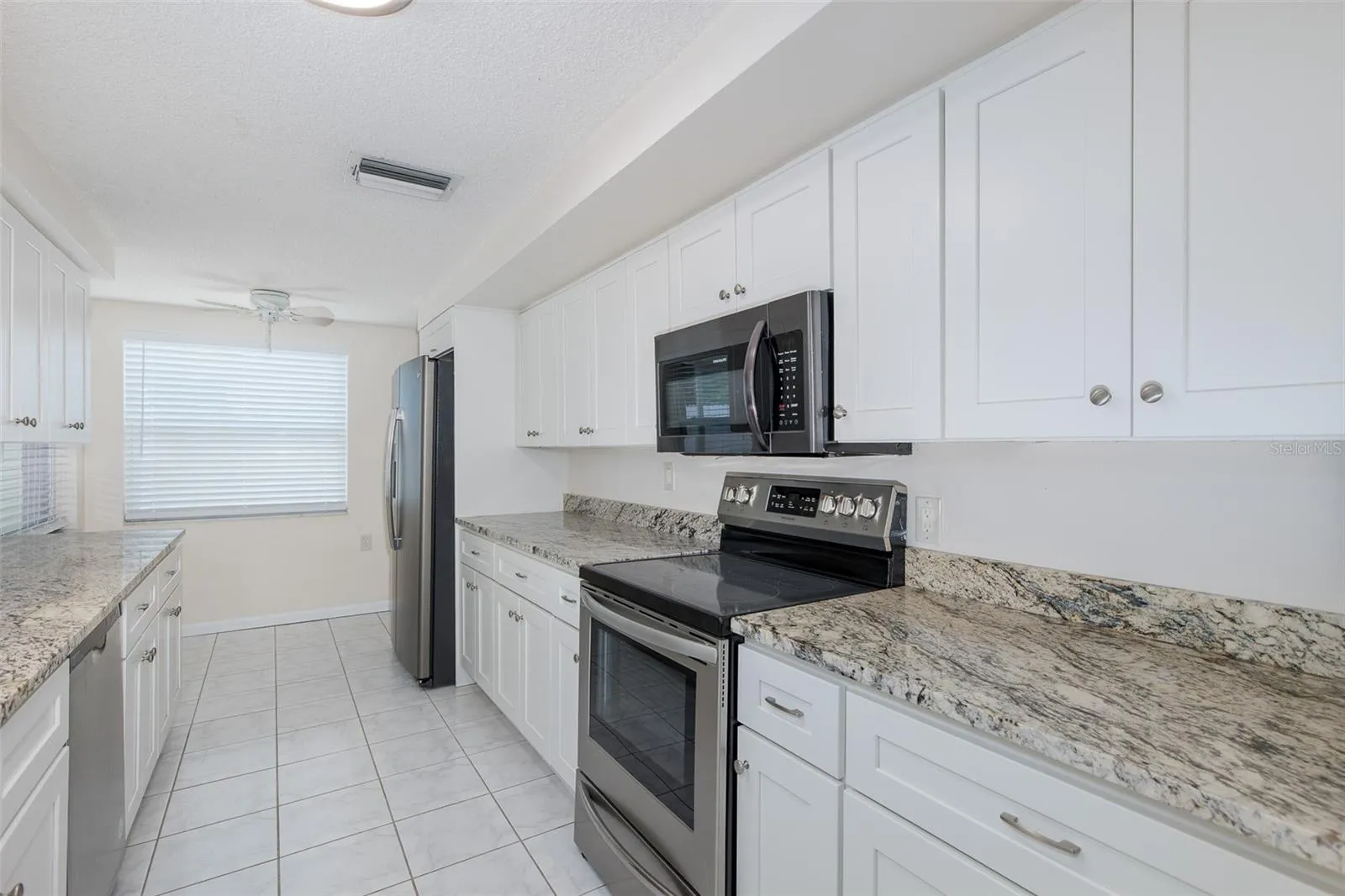 Galley Kitchen with Granite