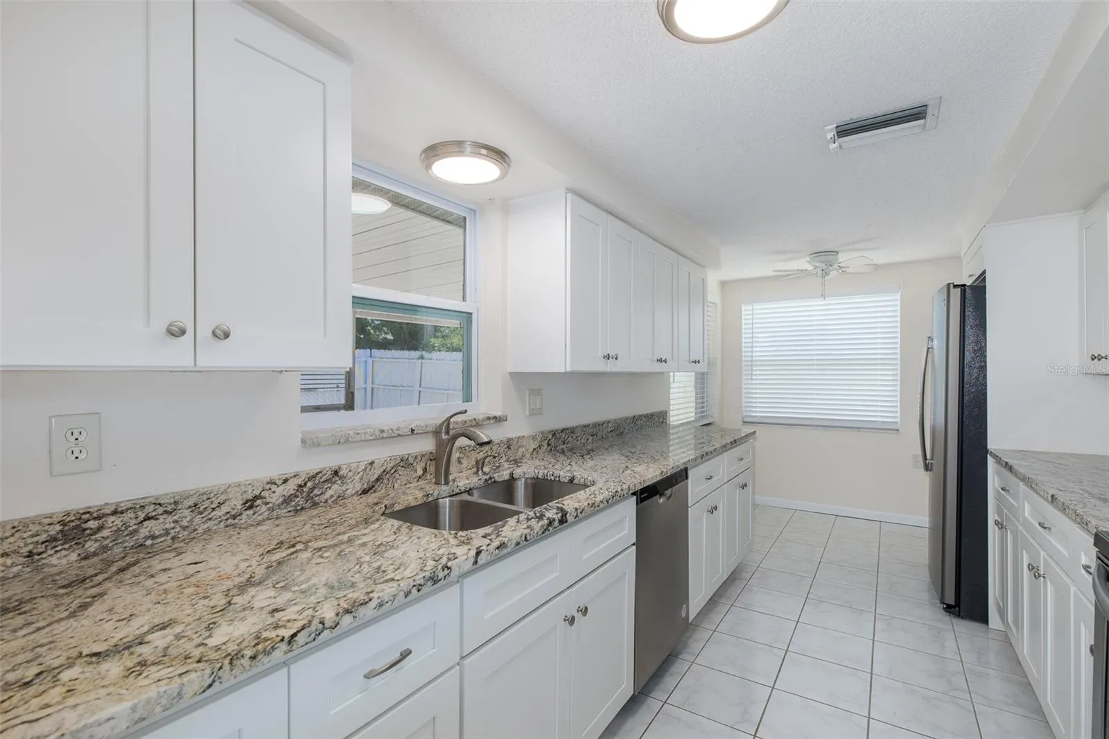 Galley Kitchen with Granite