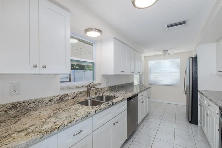 Galley Kitchen with Granite