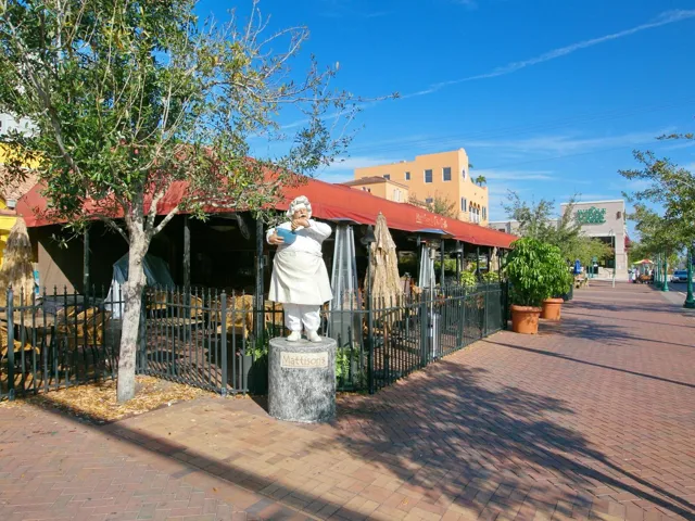 Outdoor dining downtown Sarasota with  Whole Foods in background