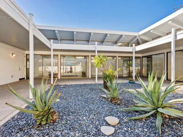Courtyard view back inside living rooms and dining room right