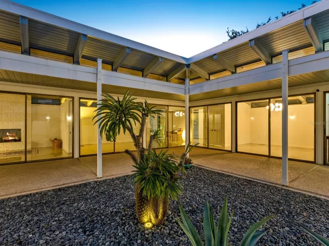 view from courtyard back inside home at dusk