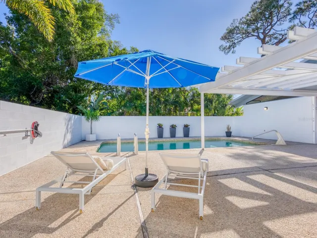 From 3rd bedroom looking at private saltwater pool and lounge area