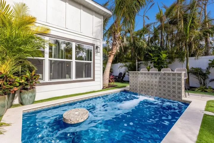 Custom heated pool/spa with waterfall feature