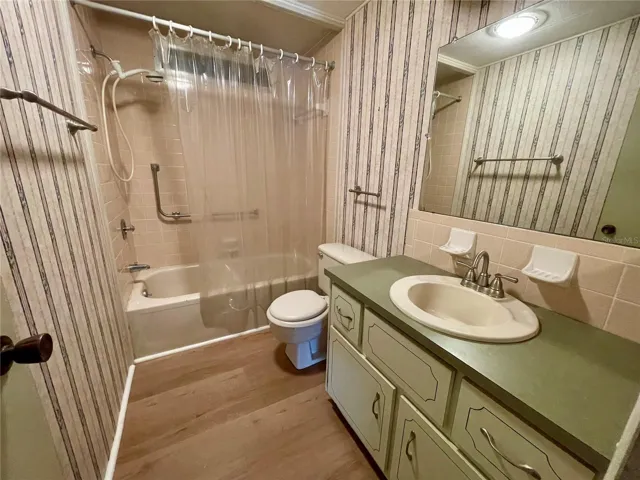 New plywood and vinyl in hall bathroom