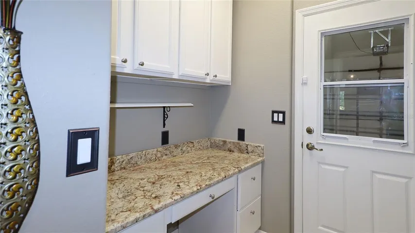 Bonus Room / Desk Area by Garage Entrance