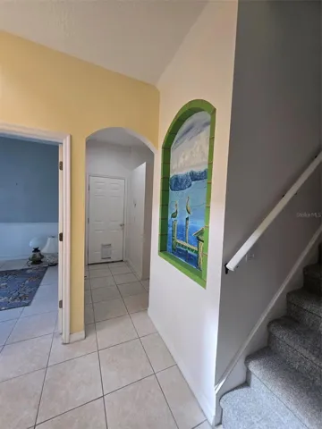 hallway to half bath and garage