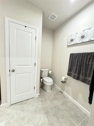 Master Linen Closet and Toilet