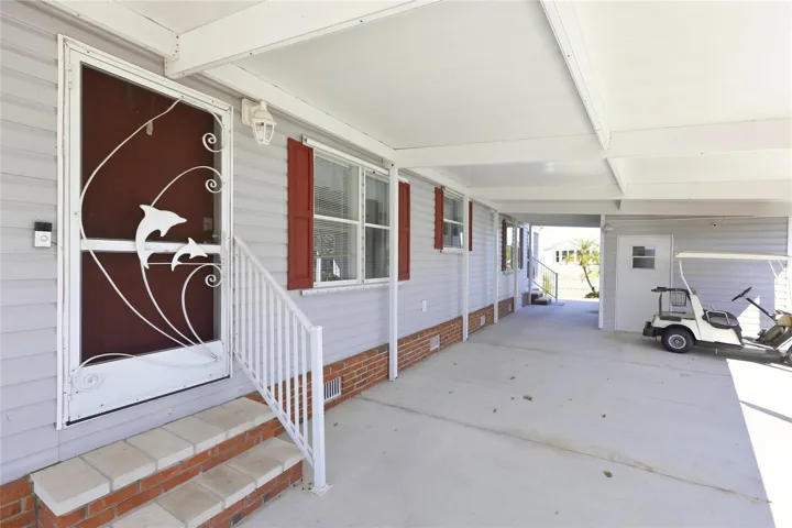 Entry from covered parking/carport