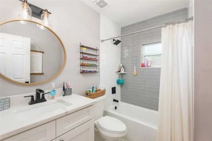 Roomy main bathroom has tub and shower combo