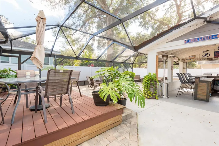 Entertainment area delivered outdoor living in vaulted screen enclosure