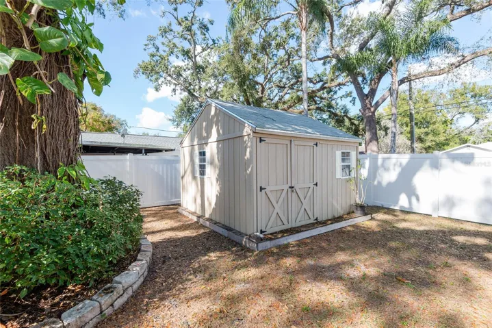 Shed on side yard provides additional storage