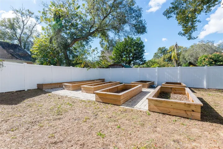 Pavers surround the above-ground planters