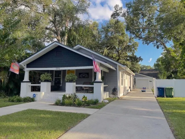 Long drive leads to garage in backyard