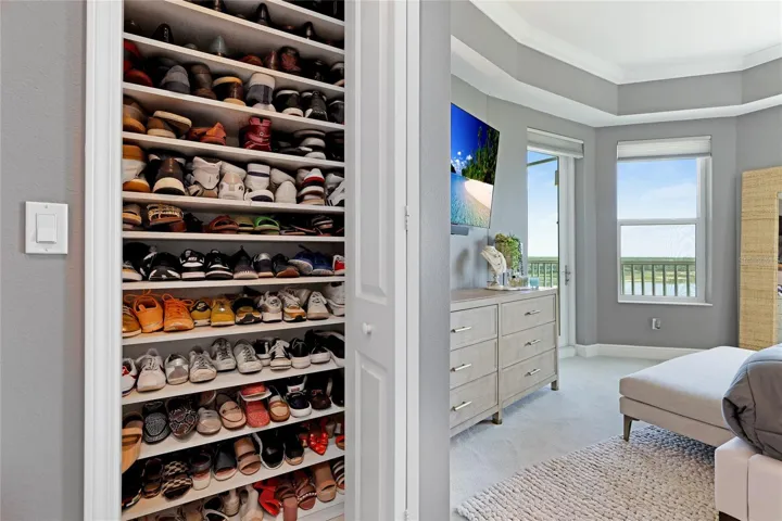 owners suite closet 2 with custom shelving