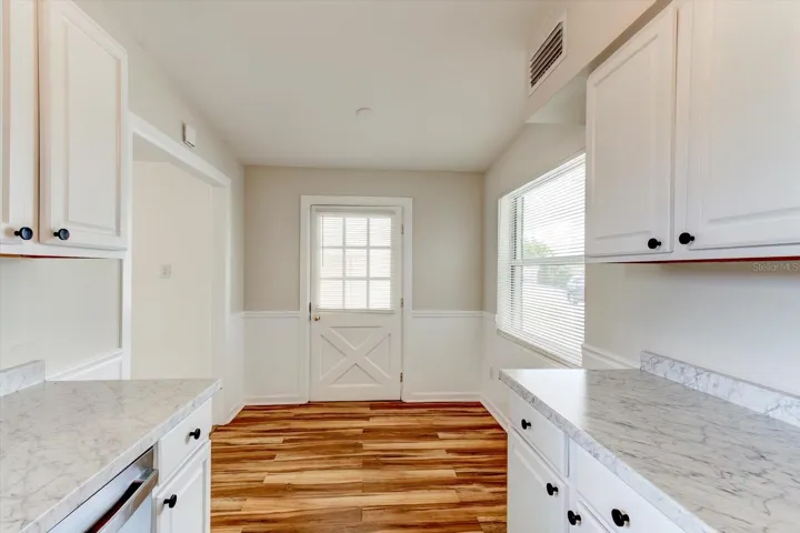 View of eat-in kitchen nook.  Door leads to carport.