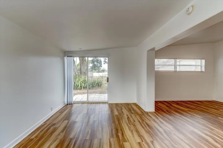 View of family room which has sliding door to outdoor space.