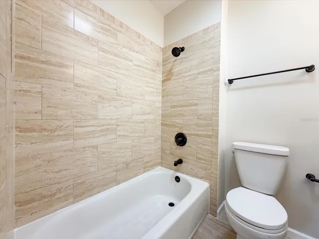 Guest bathroom with tub and shower.