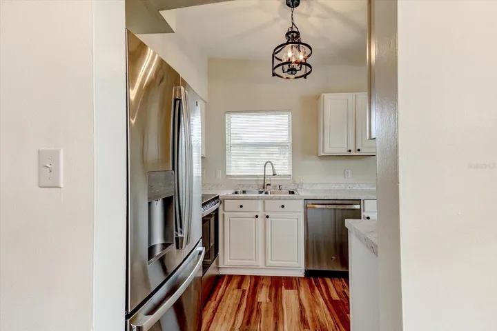 Kitchen entryway off of dining room and front door.