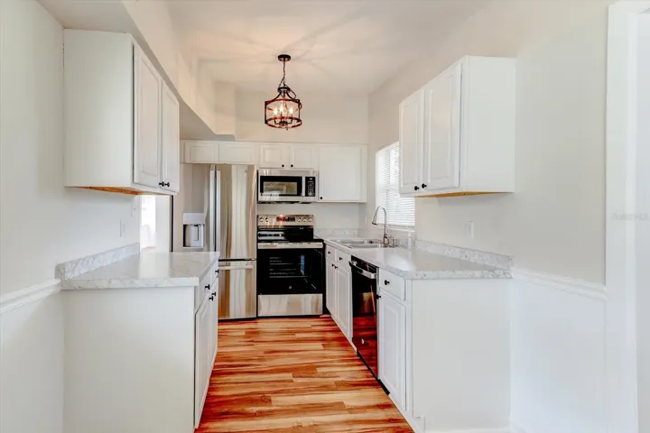 Kitchen view from carport entryway.
