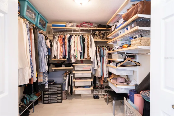 Primary bedroom walk-in closet