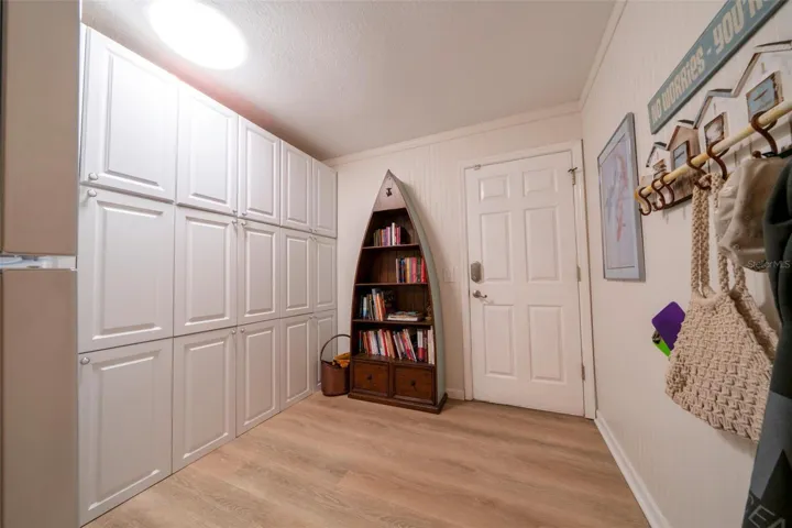 Large bonus/storage room. Lots of built-in cabinets, and right off the garage.
